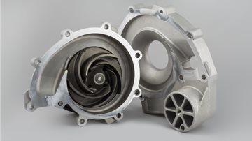 yellow sports car driving down road